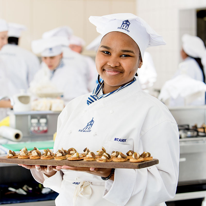 students cooking in kitchen at silwood school of cookery