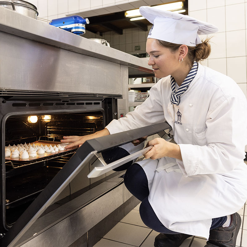 students cooking in kitchen at silwood school of cookery